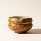 Kumora matcha bowl in Amber, front view showing the pouring spout