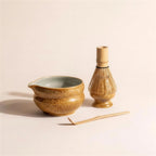 Kumora four-piece matcha set in Amber — ceramic bowl, whisk holder, bamboo whisk and scoop