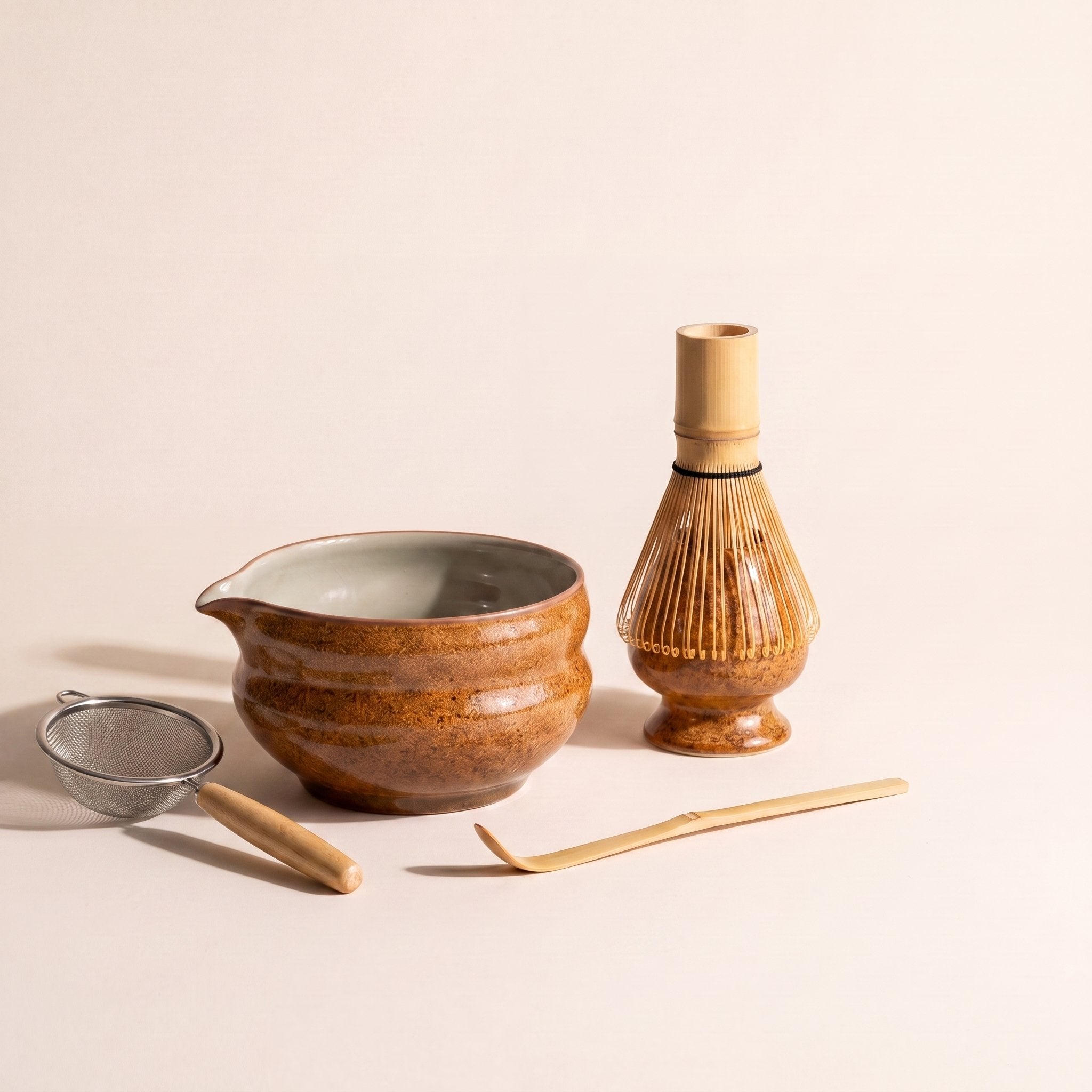Kumora five-piece matcha set in Amber — bowl, whisk holder, whisk, scoop and sifter