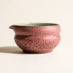 Kumora matcha bowl in Ash Rose, side profile showing the waisted form