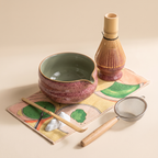 Kumora 7-piece matcha set in Ash Rose — elevated hero of the full set styled on the printed mat