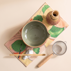 Kumora 7-piece matcha set in Ash Rose — flat top-down view of the whole set on the printed mat