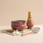 Kumora 7-piece matcha set in Ash Rose — straight-on front view, bowl spout and whisk stand in silhouette