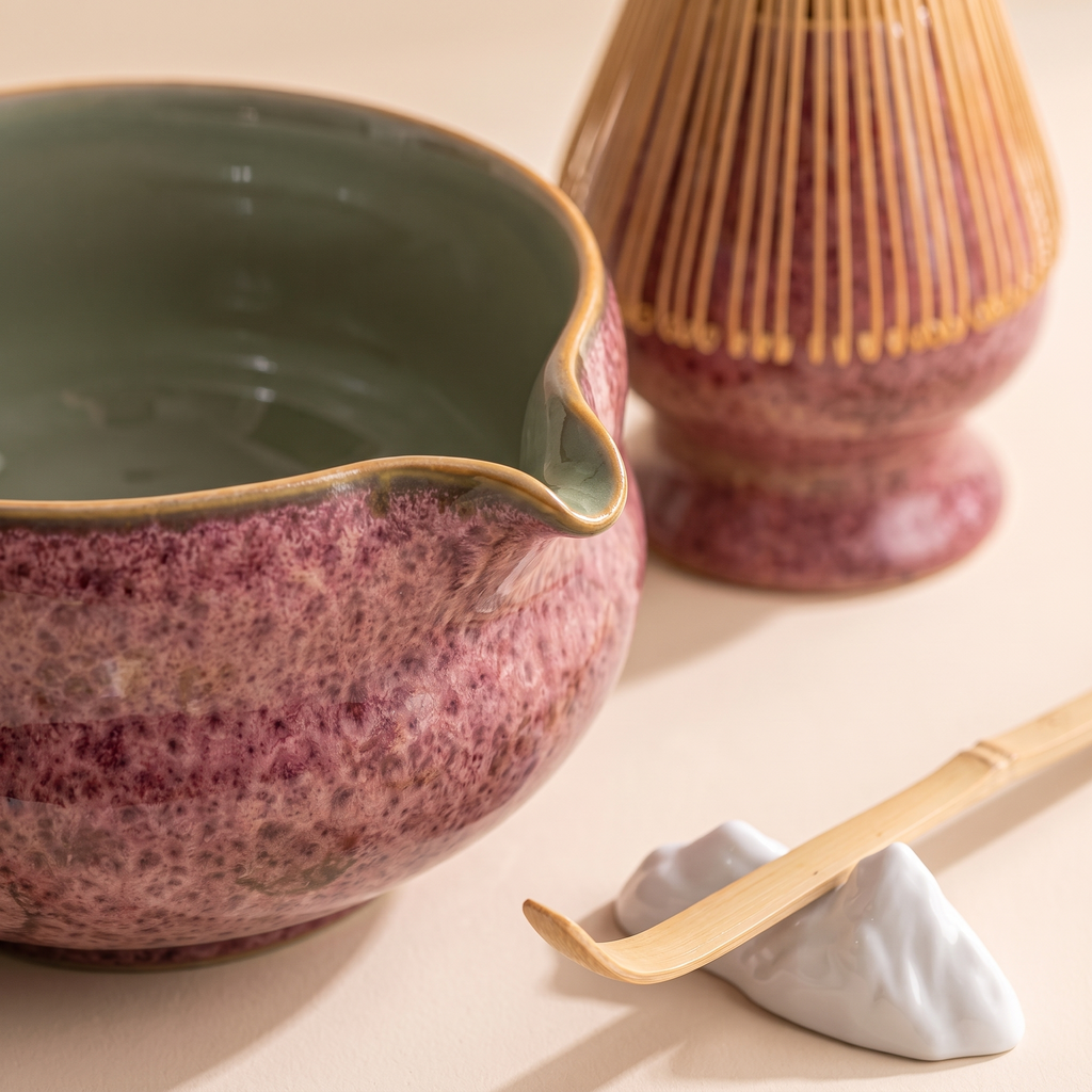 Kumora 7-piece matcha set in Ash Rose — macro of the tan rim, beak spout, sage interior, whisk stand and scoop rest