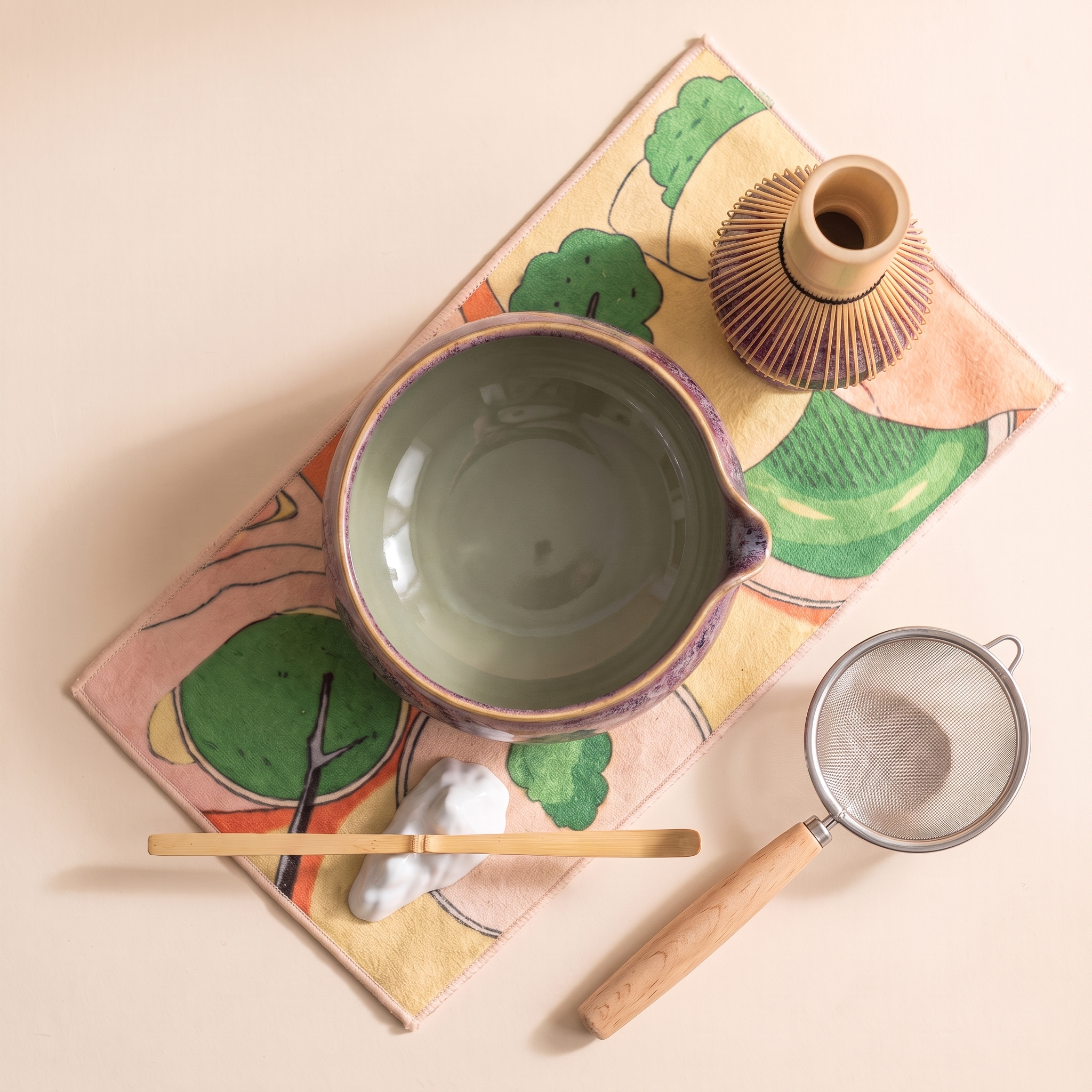 Kumora 7-piece matcha set in Aubergine — flat top-down view of the whole set, celadon bowl interior facing up