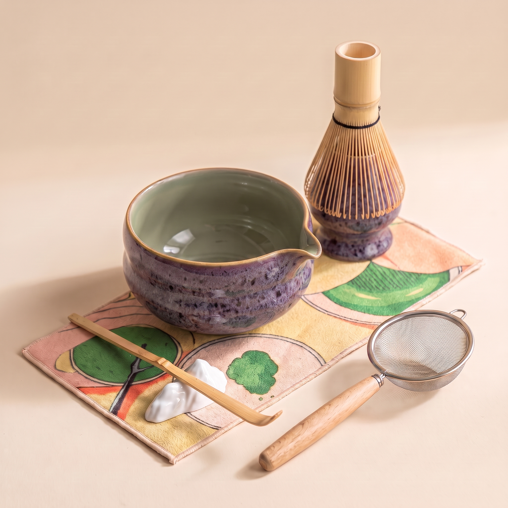 Kumora 7-piece matcha set in Aubergine — tighter three-quarter angle on the spouted bowl, whisk stand, sifter and scoop