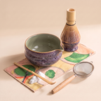 Kumora 7-piece matcha set in Aubergine — tighter three-quarter angle on the spouted bowl, whisk stand, sifter and scoop